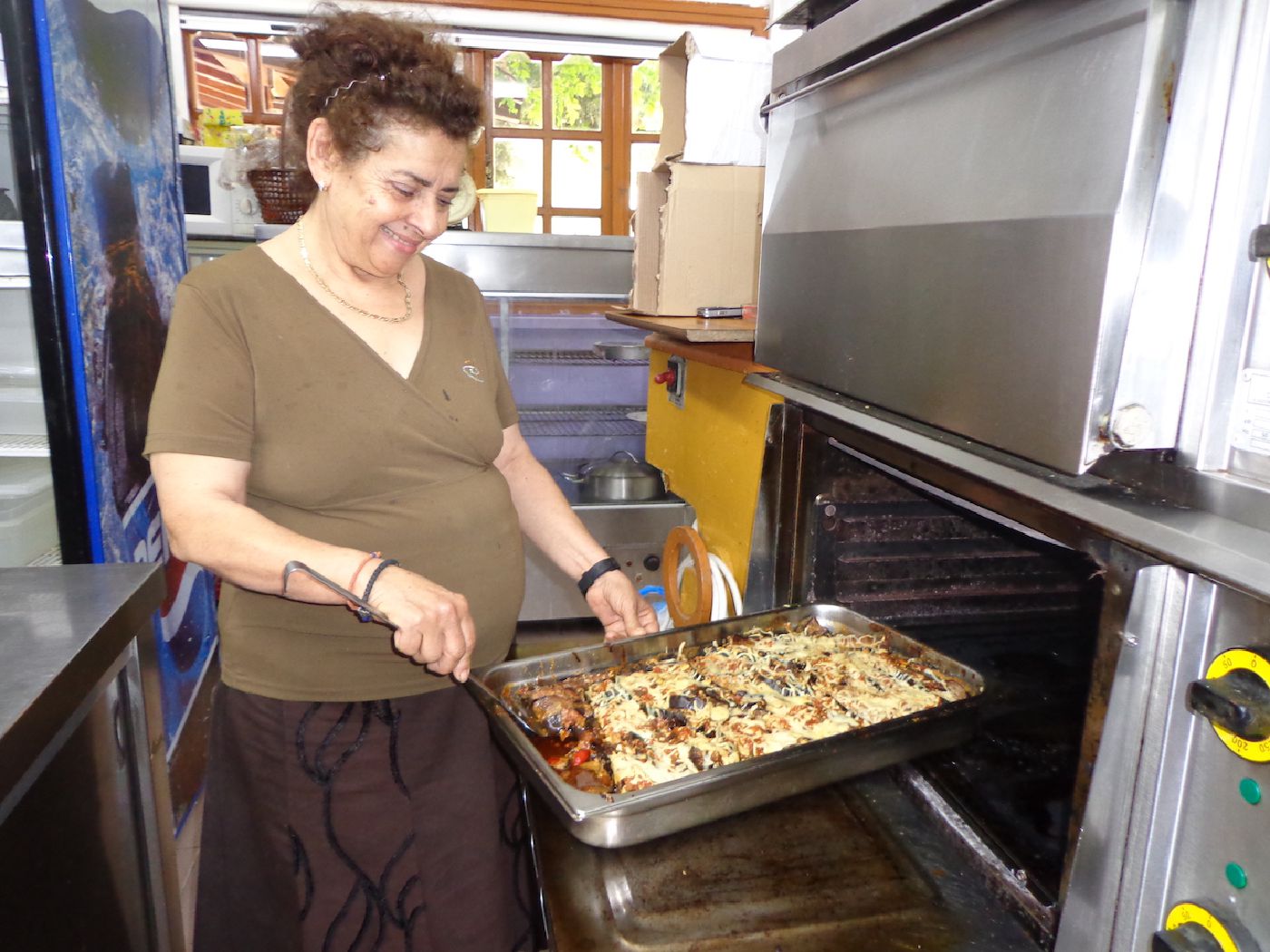 Mama Soula cooking traditional Greek dishes